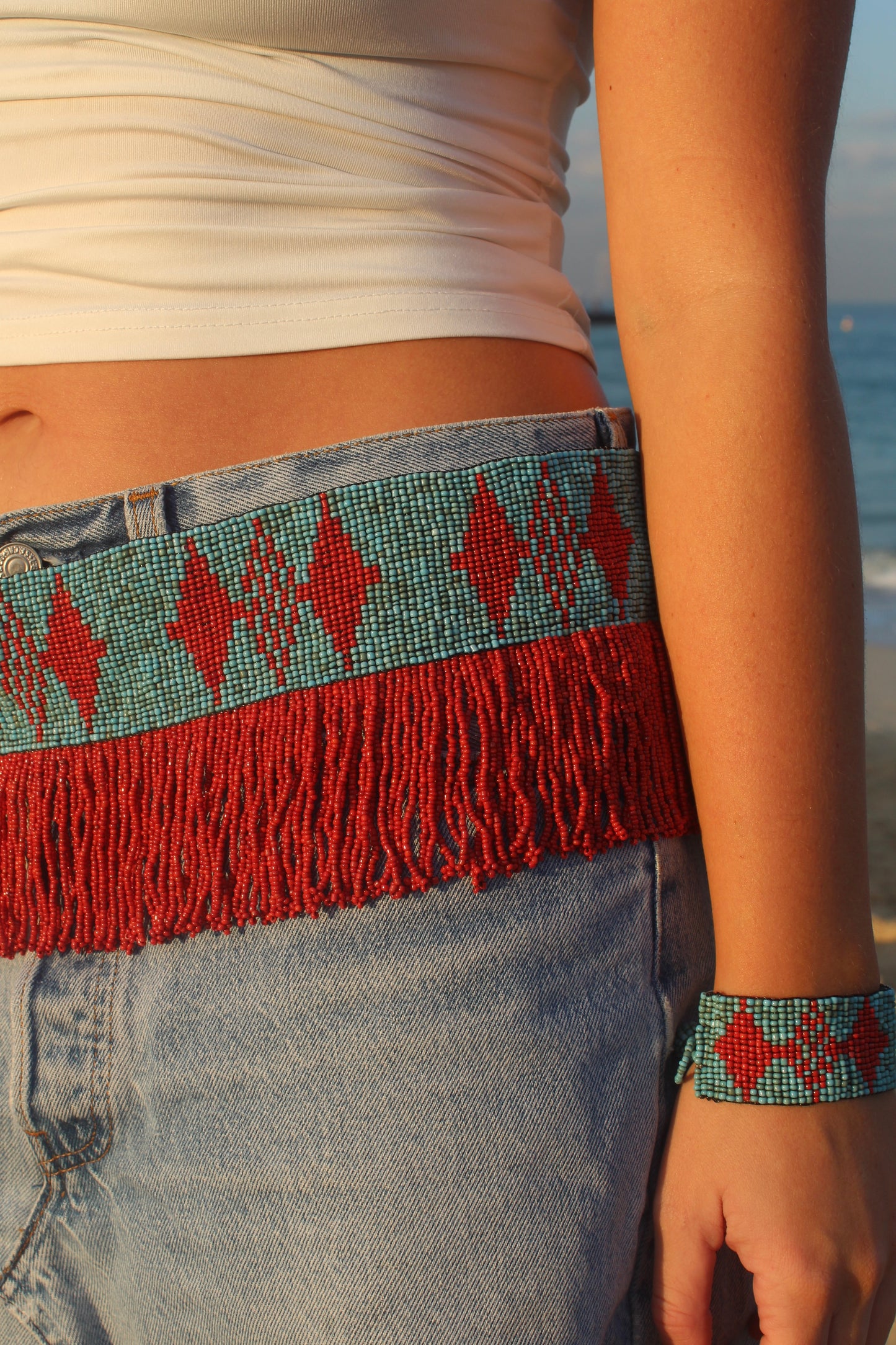 The Mirage Fringe Belt in Coral and Turquoise