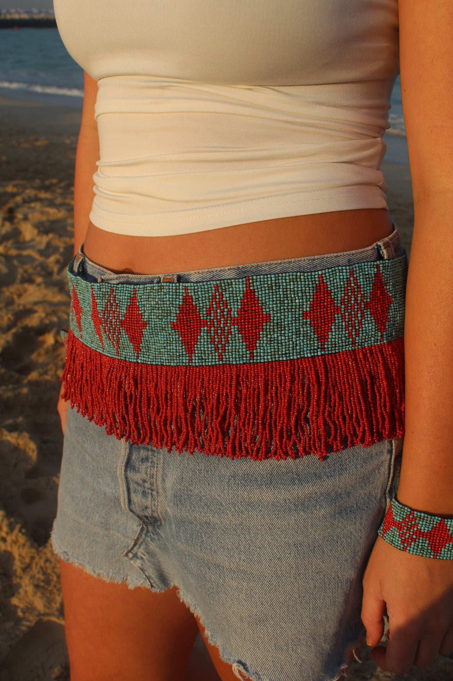 The Mirage Fringe Belt in Coral and Turquoise