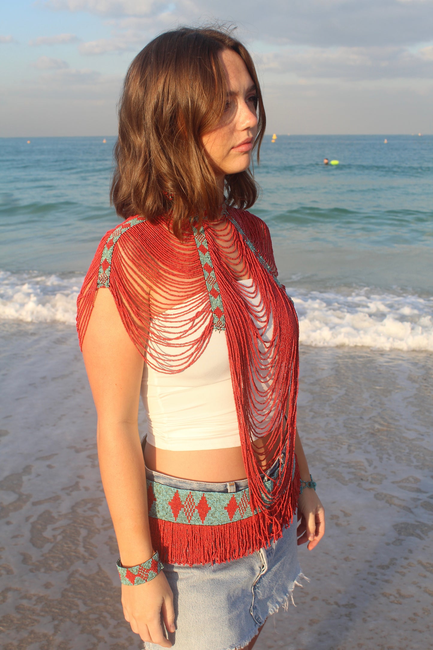 The Soleil top in Coral and Turquoise